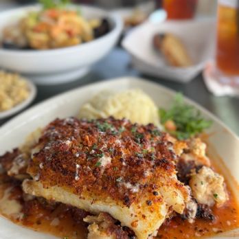 The Lobster Pot - $35 PORTUGUESE FISH: signature fish crusted with RITZ CRACKERS! It's sweet and crunchy and flaky and HUGE! AMAZING! - Seafood Near Me - Provincetown, Massachusetts