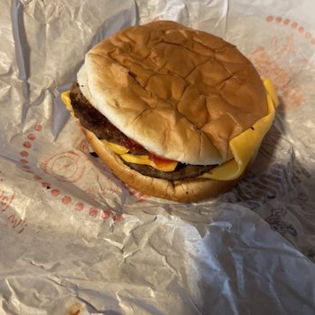 McDonald's - a cheeseburger on a wrapper - Burgers Near Me - Dearborn Heights, Michigan McDonald's - a cheeseburger on a wrapper - Burgers Near Me - Dearborn Heights, Michigan