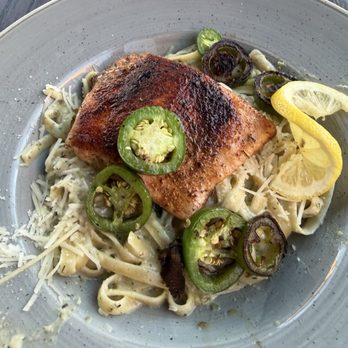 Doña Magnolia - Jalapeño cilantro infused fettuccini Alfredo with salmon. - Mexican Near Me - Spokane, Washington Doña Magnolia - Jalapeño cilantro infused fettuccini Alfredo with salmon. - Mexican Near Me - Spokane, Washington