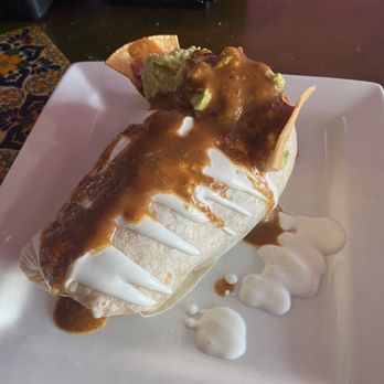 Taqueria - Birria burrito after adding hot sauce - Mexican Near Me - Long Beach, New York
