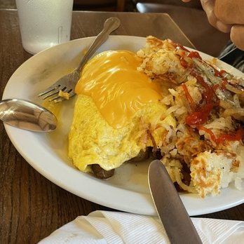 The Pantry - A sausage "omelet". Sausage chopped up and blanketed over an over cooked egg sheet with a slice of American cheese melted on top - Breakfast & Brunch Near Me - San Mateo, California The Pantry - A sausage "omelet". Sausage chopped up and blanketed over an over cooked egg sheet with a slice of American cheese melted on top - Breakfast & Brunch Near Me - San Mateo, California