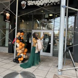 a woman standing in front of a store