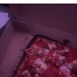 The burnt and cold pizza I received. The burnt and cold pizza I received.