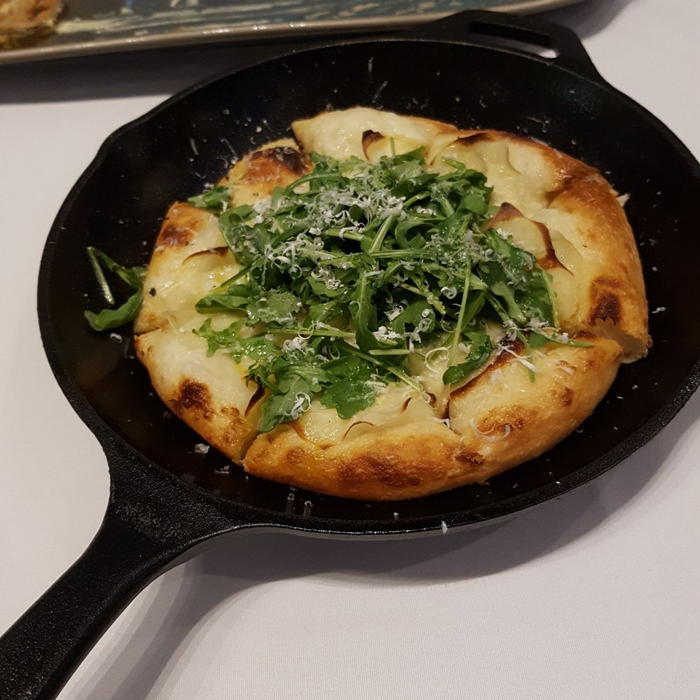 Petros82 - Potato pugliese-$19 "pizza" with thin crunchy potato slices, marscapone, arugula on fresh bread - Mediterranean Near Me - Toronto, Ontario Petros82 - Potato pugliese-$19 "pizza" with thin crunchy potato slices, marscapone, arugula on fresh bread - Mediterranean Near Me - Toronto, Ontario