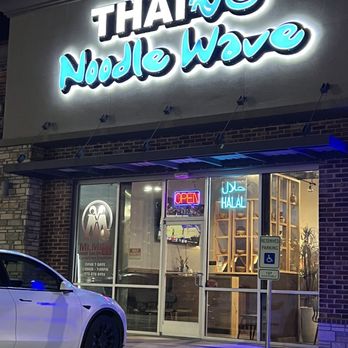Thai Noodle Wave - a car parked in front of a restaurant - Thai Near Me - Carrollton, Texas Thai Noodle Wave - a car parked in front of a restaurant - Thai Near Me - Carrollton, Texas
