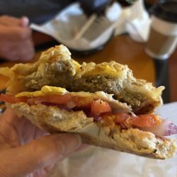 Flood City Cafe - Everything bagel sandwich with sausage, egg, pepper Jack & provolone cheese, tomato & onion