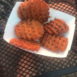 Belly Up Arkansas - Already half eaten but by far the best sweet potato fries in town. the sweet butter sauce is amazing. & the owner is great too.