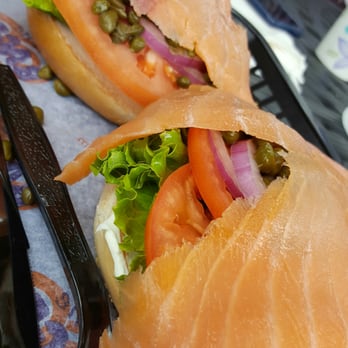 Bagel Cafe - Salmon, capers and tomatoes on everything bagel with cream cheese. - Bagels Near Me - Herndon, Virginia Bagel Cafe - Salmon, capers and tomatoes on everything bagel with cream cheese. - Bagels Near Me - Herndon, Virginia