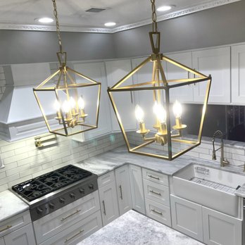 GS Builds - a kitchen with a marble countertop and white cabinets - Flooring Near Me GS Builds - a kitchen with a marble countertop and white cabinets - Flooring Near Me