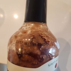 Expired bloody mary mix sold at checkout counter.