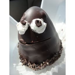 a chocolate egg with whipped cream on top