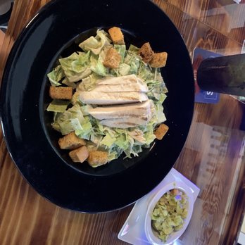 Mavericks Hangar Bar & Grill - Chicken Caesar salad and fresh table side guacamole - New American Near Me - Satellite Beach, Florida Mavericks Hangar Bar & Grill - Chicken Caesar salad and fresh table side guacamole - New American Near Me - Satellite Beach, Florida