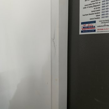 City Tile & Cabinets - Crack in the material used to frame for the fridge - Flooring Near Me - Anaheim, California