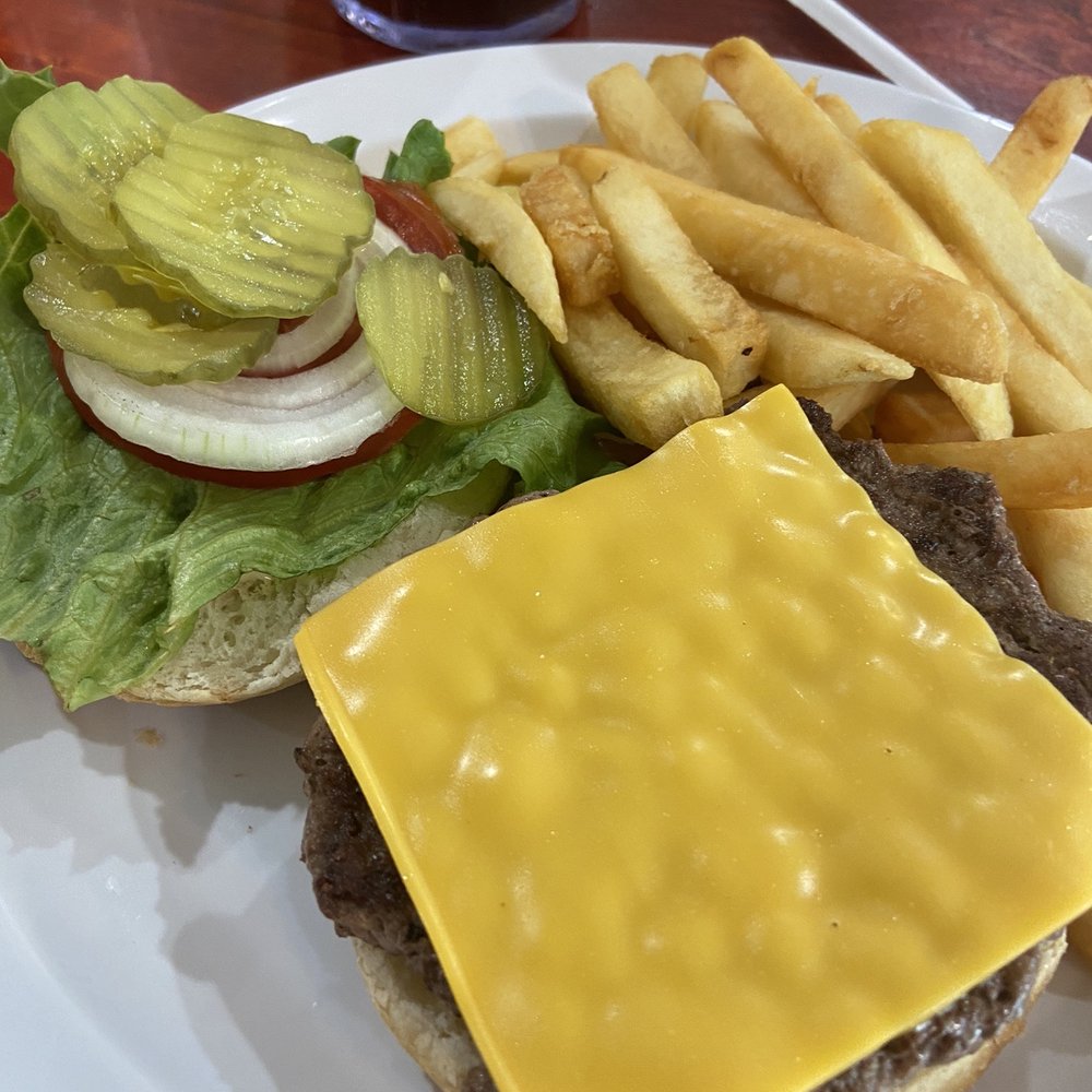 Deluxe cheeseburger with fries and a coke.