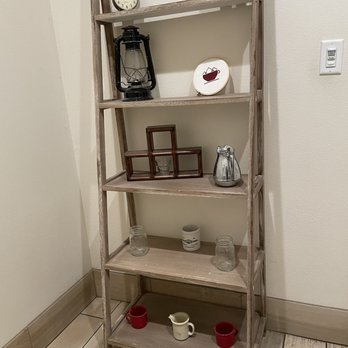 Round Mountain Coffee - a shelf with a clock on it - Coffee Roasteries Near Me - Conway, Arkansas