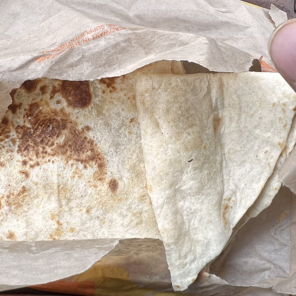 Taco Bell - Chicken Quesadilla with half filing - Fast Food Near Me - Kyle, Texas Taco Bell - Chicken Quesadilla with half filing - Fast Food Near Me - Kyle, Texas