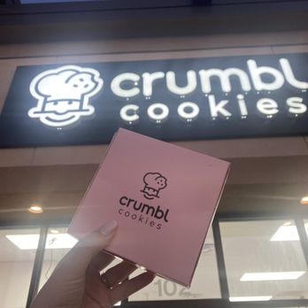 Crumbl - Sun Prairie - Crumbl cookie with sign - Bakeries Near Me - Sun Prairie, Wisconsin