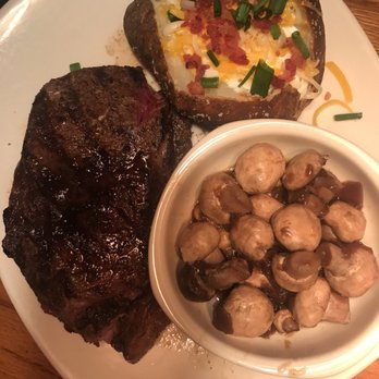 Outback Steakhouse - Ribeye with baked potato and sautéed mushrooms. - Steakhouses Near Me - Chandler, Arizona