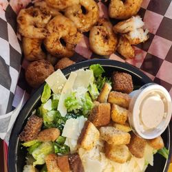Crooked Creek Marina - Blackened grilled shrimp with hush puppies and a side Cesar salad. Side of cole slaw.