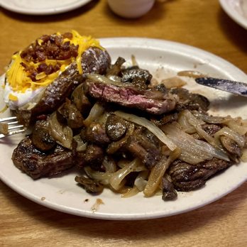 Texas Roadhouse - Ft. Worth Ribeye smothered with onions/mushrooms & a loaded baked potato - Steakhouses Near Me - Menifee, California