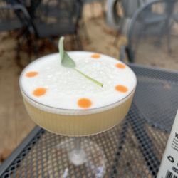 Grigio Wine & Cocktail Bar. - Another pretty drink! A mezcal, tequila, orange, egg white concoction.