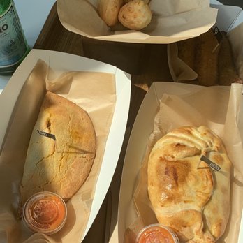 Que Gusto - Gluten Free Beef Empanada (front left), Tomato and Cheese Empanada, Yucca bread (back left), Fried Plantains (hard to see middle right) - Latin American Near Me - Tulsa, Oklahoma Que Gusto - Gluten Free Beef Empanada (front left), Tomato and Cheese Empanada, Yucca bread (back left), Fried Plantains (hard to see middle right) - Latin American Near Me - Tulsa, Oklahoma