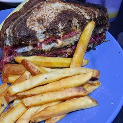 Bad Boyz Bistro - Half my Reuben sandwich - I had already eaten the other half and the dill pickle spear - delicious!