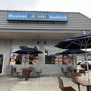 Los Cabos - a mexican restaurant with tables and umbrellas - Mexican Near Me - San Marcos, California