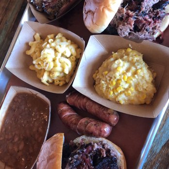 Caldwell County BBQ - Two brisket sandwiches, ribs, beans, Mac & Cheese, cornbread casserole & jalapeño cheese sausage - Barbeque Near Me - Gilbert, Arizona