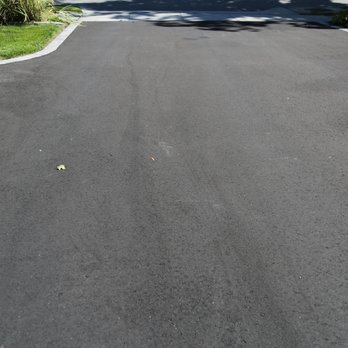 Opal Construction - Drag marks from a hose left by Opal on my driveway - General Contractors Near Me - Bay Shore, New York