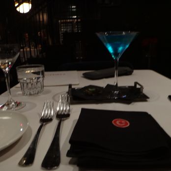 Caterina's - a table setting with a drink and silverware - Wine Bars Near Me - Fort Worth, Texas