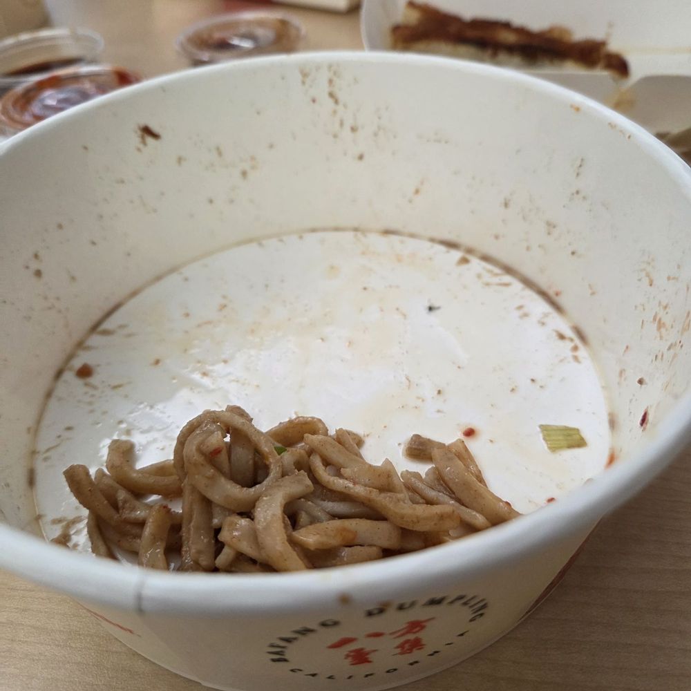 Bafang Dumpling - Sesame noodle with a fly at the bottom of the bowl. It was fully marinated in the noodle sauce. - Taiwanese Near Me - Van Nuys, California