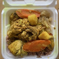 Tony's Caribbean Kitchen - Curry chicken served with rice, stewed veggies and plantains