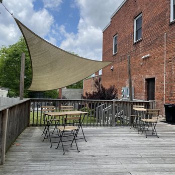 Rofhiwa Book Café - a patio with tables and chairs - Bookstores Near Me - Durham, North Carolina Rofhiwa Book Café - a patio with tables and chairs - Bookstores Near Me - Durham, North Carolina