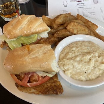 St Augustine Fish Camp - Pan Fried Fish Sandwich with grits and French fries $14 - Seafood Near Me - St Augustine, Florida