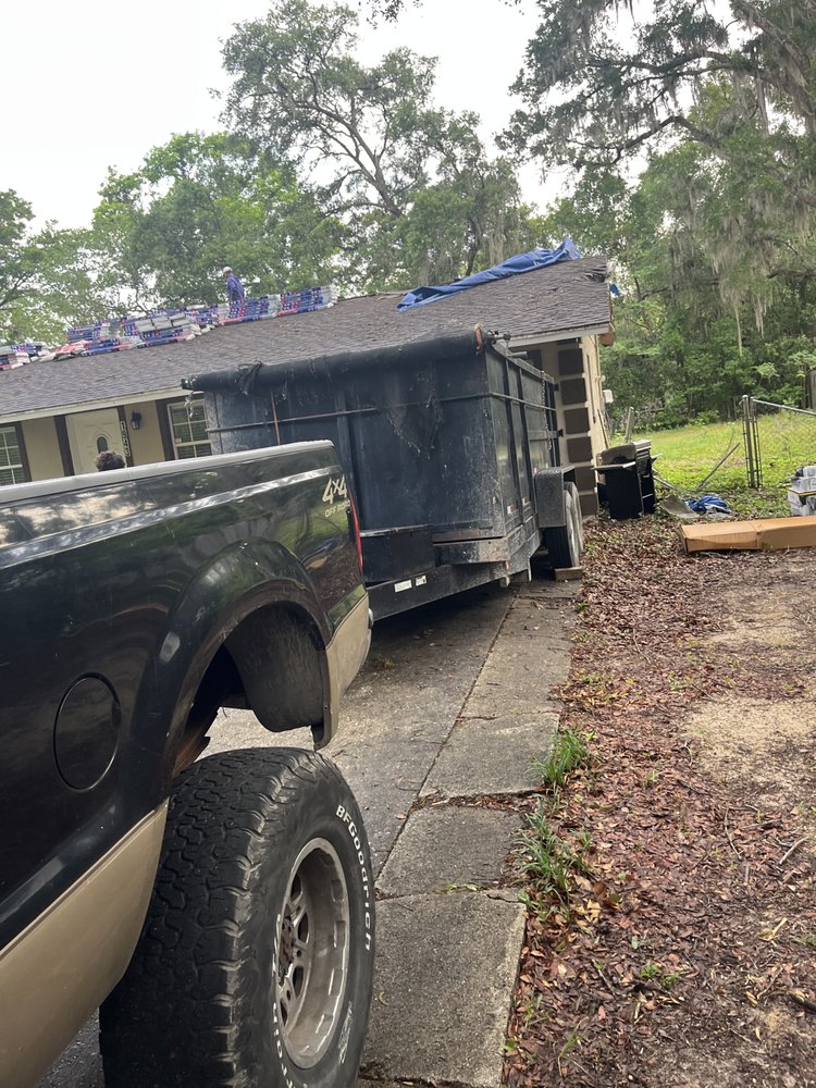 Slide of Big Jon Dumpster Services