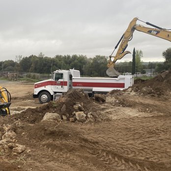 Todd Heldt Excavating - Moving soil in preparation for a new parking lot - Excavation Services Near Me Todd Heldt Excavating - Moving soil in preparation for a new parking lot - Excavation Services Near Me