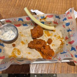 Kelseys Original Roadhouse - Orange Chicken bites with a white blue cheese dip and long stick of celery.