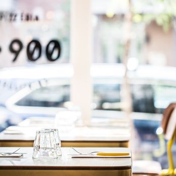 N° 900 - a table and chairs in a restaurant - Pizza Near Me - Montreal, Quebec N° 900 - a table and chairs in a restaurant - Pizza Near Me - Montreal, Quebec