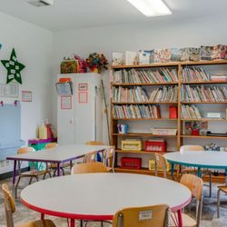 Our library, easels for painting and tables for art, play dough and practicing writing.