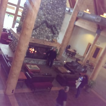 Talkeetna Alaskan Lodge - The lodge common area with a wood burning fireplace - Hotels Near Me - Talkeetna, Alaska