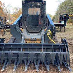 Kellys Clearing - Machine that started the company. John Deere 331.