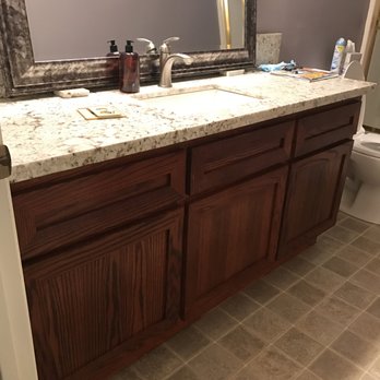 Lofton Construction And Electric - a bathroom with a marble counter top - General Contractors Near Me Lofton Construction And Electric - a bathroom with a marble counter top - General Contractors Near Me
