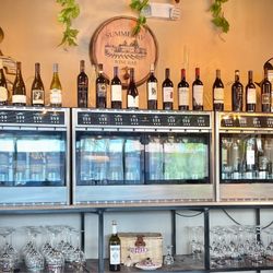 SummeRay Wine Bar & Local Eatery - Self service wine pouring. Three coolers with 8 bottles each.
