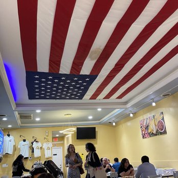 Giovanni's Pizza & Pasta - a large american flag hanging from the ceiling - Pizza Near Me - Pittsburgh, Pennsylvania Giovanni's Pizza & Pasta - a large american flag hanging from the ceiling - Pizza Near Me - Pittsburgh, Pennsylvania