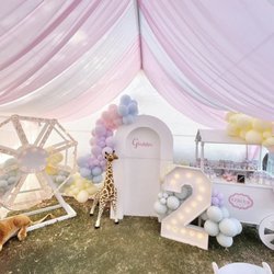 Seven Events - 2nd Girl Birthday pastel circus themed with light up ferris wheel, white arch, light up number marquee, and candy cart