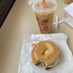 Dunkin' - Bacon Egg and Cheese on a Plain Stuffed Bagel with an iced coffee