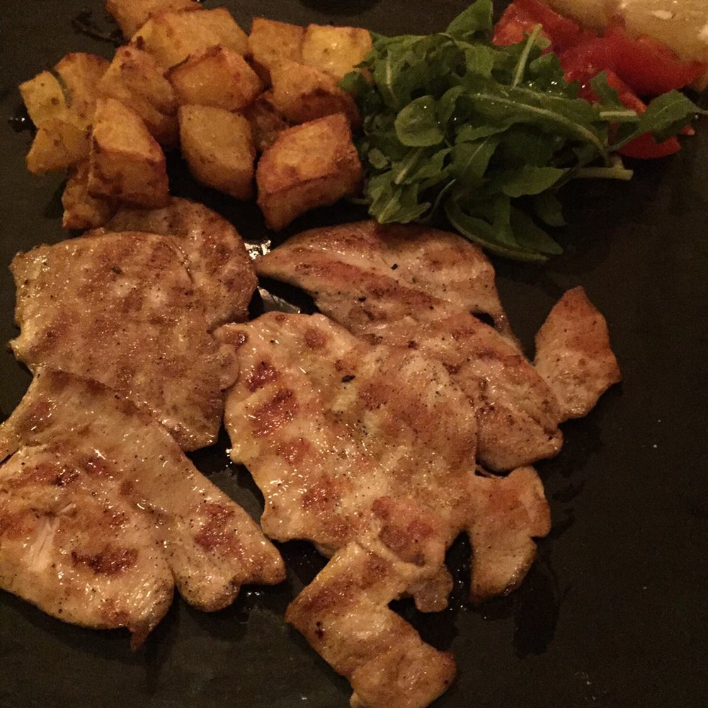 Fried chicken, fried potatoes, and salad Fried chicken, fried potatoes, and salad