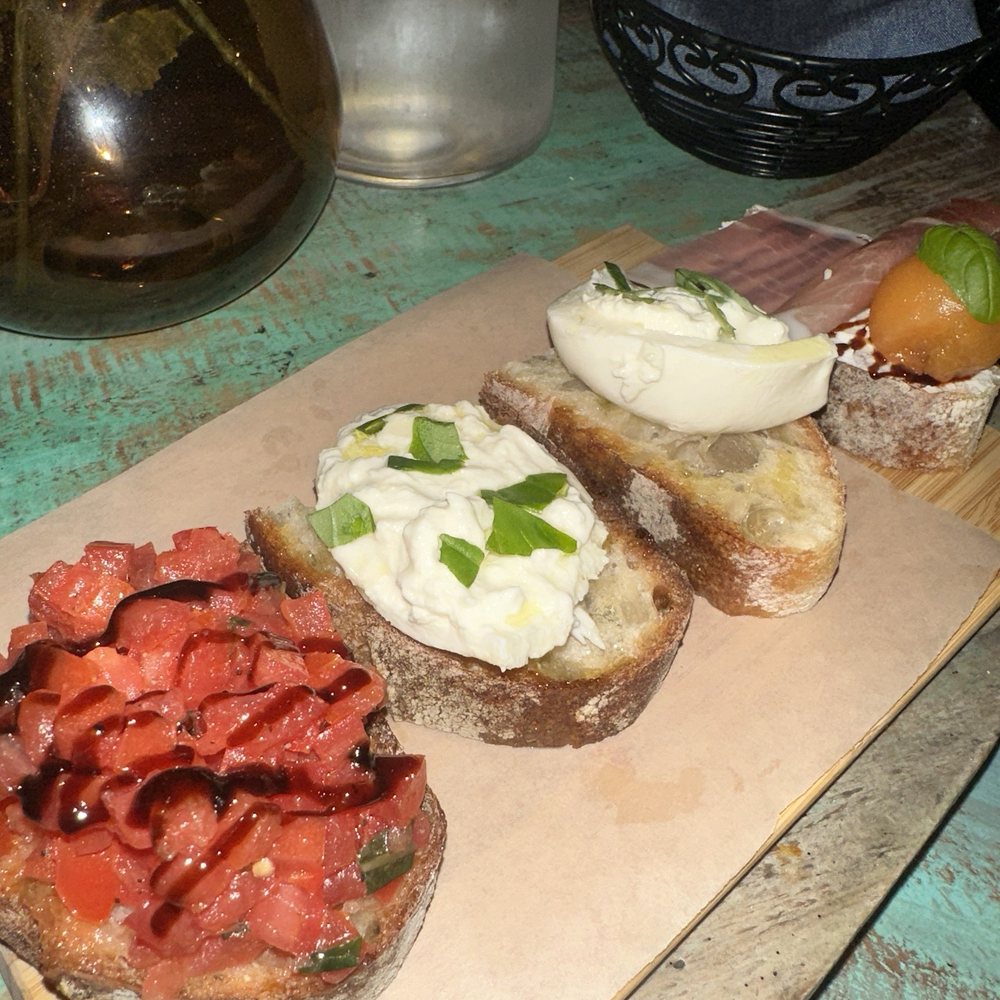 Luca Turci - Bruschetta trio cut in half for sharing - Italian Near Me - Winter Park, Florida Luca Turci - Bruschetta trio cut in half for sharing - Italian Near Me - Winter Park, Florida