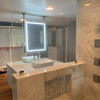 Whole Home Experts - a large bathroom with a walk in shower - Roofing Near Me Whole Home Experts - a large bathroom with a walk in shower - Roofing Near Me